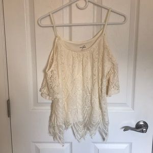 A white lace cold shoulder white shirt.